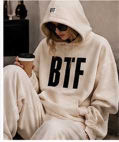 The BTF hoodie in sand, hood up, worn as a set
